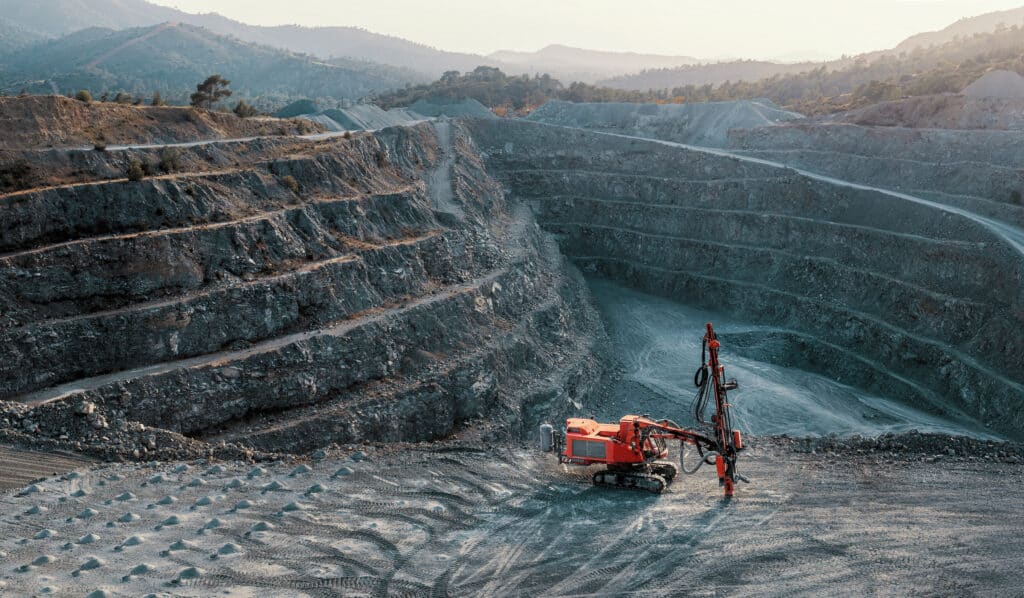 Red stone crusher terrace gravel quarry industrial landscape no people